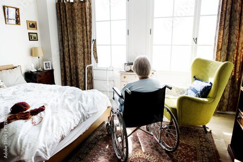 elderly women in wheelchair in old folks home