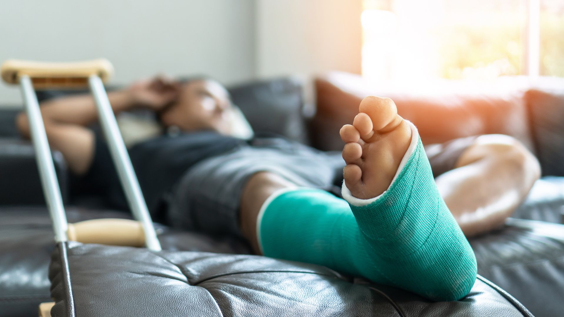 man with broken leg