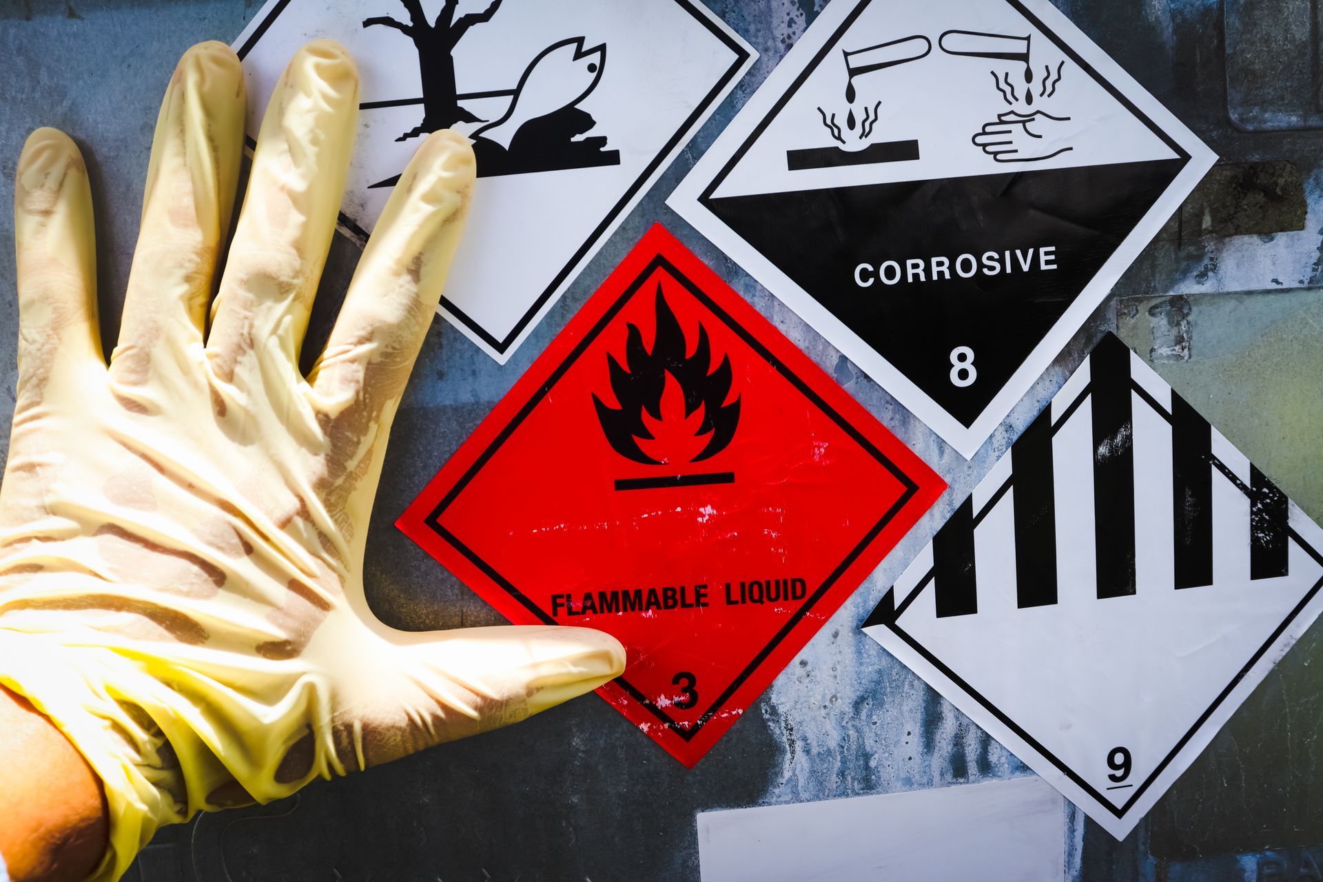 warning sign with dangerous Flammable Liquid and Corrosive chemicals what to do when exposed to chemicals at work