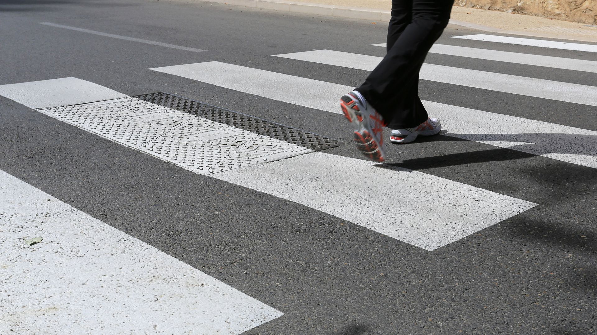 woman walking on crosswalk